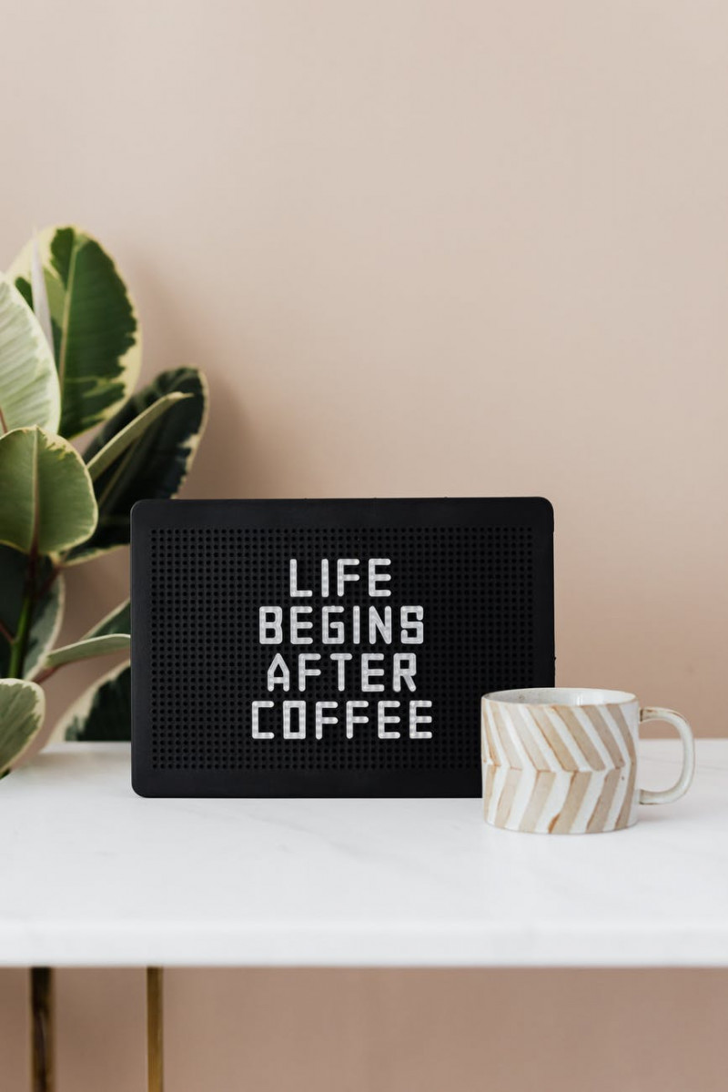 board with life begins after coffee message and coffee cup