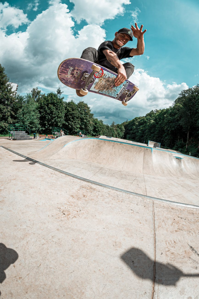 photo of man playing skateboard