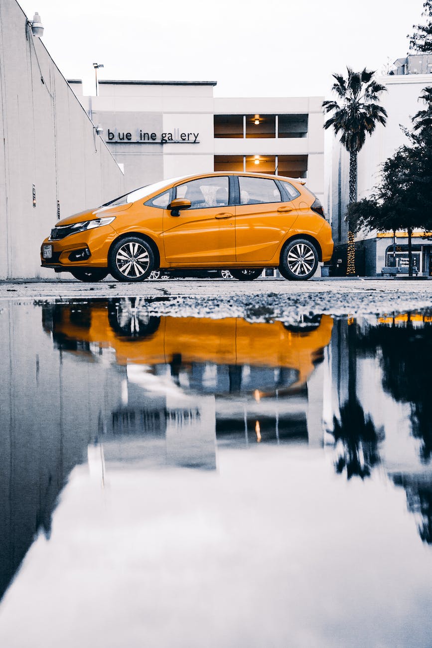 photo of yellow car during daytime
